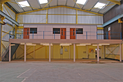 You can see the benefit of this mezzanine floor. This company - a reclamation and recycling plant in Sunderland, needed all the floor space for recycling. Our mezzanine now provides 3 offices above without loosing that precious production area. Click on the photo to visit their website.